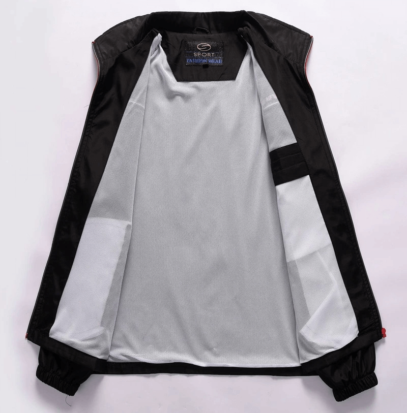 Interior view of athletic zip-up jacket with black exterior and soft white lining, showcasing sleek design and sportswear label.